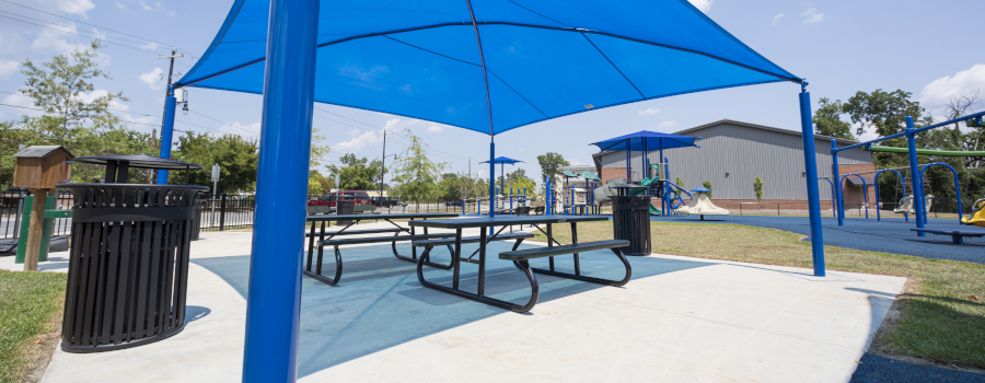 Trash Receptacles in an outdoor seating area with picnic tables