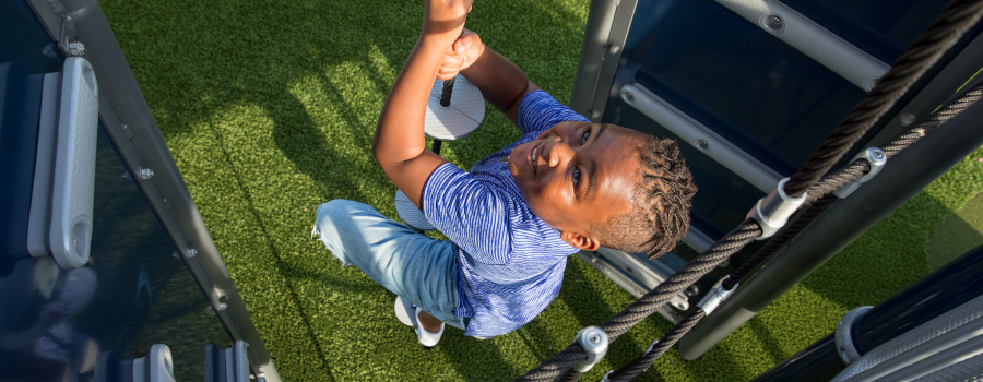 Boy climbing a rope