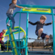 Children playing on Miracle's Champions Trek obstacle course